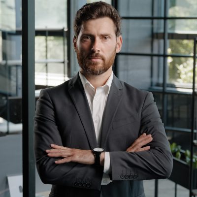 Business portrait in office serious strong confident ambitions middle-aged boss employer adult Caucasian 40s bearded man looking at camera CEO leader trader businessman crossing hands confidence pose. High quality 4k footage